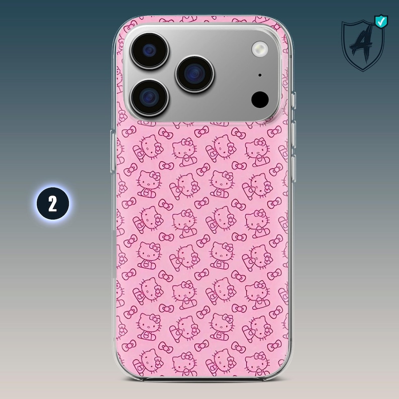 May include: Pink phone case featuring a repeating pattern of the Hello Kitty character in a darker pink. The case has a clear border and a silver camera housing. The number "2" is visible in a white circle on the left side.