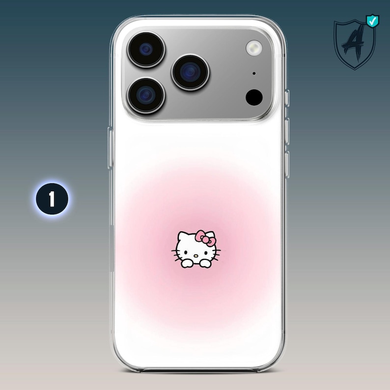 May include: Clear phone case featuring a pink gradient background with a Hello Kitty graphic. The case has a silver camera module and a protective design. The Hello Kitty graphic has a pink bow.