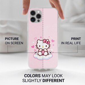 May include: A pink phone case featuring a Hello Kitty design. The design includes a white cat with a pink bow, sitting on a cloud, surrounded by hearts and stars. The text "COLORS MAY LOOK SLIGHTLY DIFFERENT" is at the bottom.