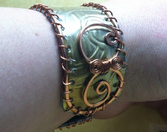 old bronze weatherstripping & copper cuff lined with teal rcycled leather