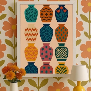May include: A framed art print featuring a grid of twelve decorative vases in various colors and patterns. The vases include designs with leaves, diamonds, zigzags, swirls, and stars. The artwork is displayed on a peach-colored background.