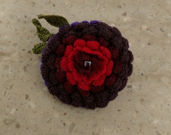 Purple and red crochet brooch