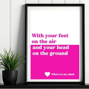 May include: A pink and white printable wall art print with the text "With your feet on the air and your head on the ground" and a heart with the text "Where is my mind".
