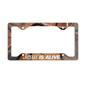 Jesus Is Alive - Metal License Plate Frame -  Christian Car Accessory, Inspirational Gift, Religious Decor, Car Enthusiasts