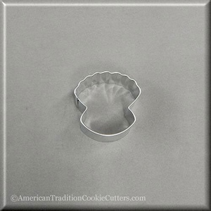 May include: A silver metal cookie cutter shaped like a seashell. The cutter has a detailed design with a scalloped edge and a smooth, rounded interior.