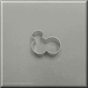 May include: A silver-colored cookie cutter in the shape of a snowman. The cutter is made of metal and has a simple, clean design. The snowman shape is composed of two circles and a head.