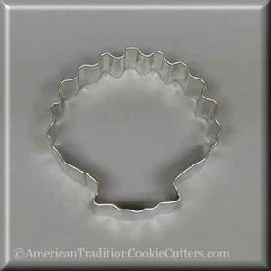 May include: A silver metal cookie cutter shaped like a seashell. The cutter has a scalloped edge and a smooth, rounded bottom.