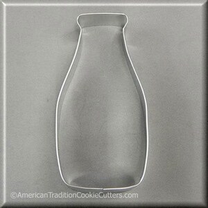 May include: A silver metal cookie cutter shaped like a milk bottle.