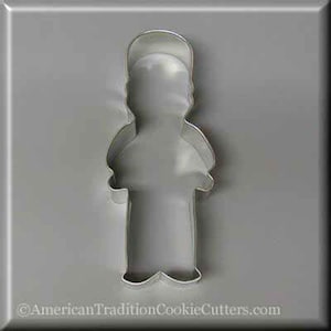 May include: A metal cookie cutter shaped like a person standing with arms at their sides. The cookie cutter is silver in color.