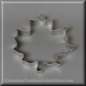May include: A silver metal cookie cutter shaped like a maple leaf.