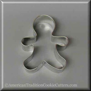 May include: A silver metal gingerbread man cookie cutter.