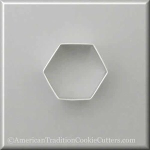 May include: A silver metal cookie cutter shaped like a hexagon.