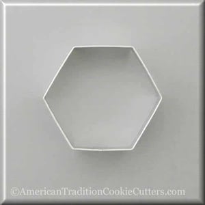 May include: A silver metal cookie cutter shaped like a hexagon. The cutter is on a white background.