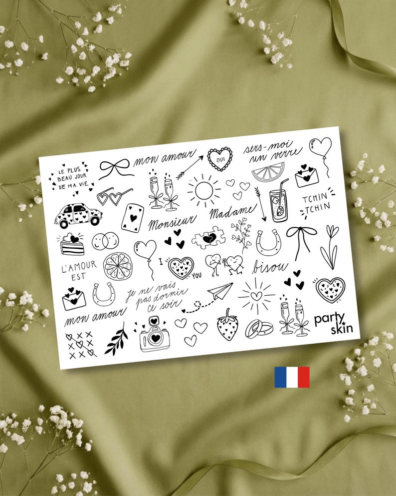 Pode incluir: Uma folha branca com ilustra&ccedil;&otilde;es em linha preta de cora&ccedil;&otilde;es, la&ccedil;os, ta&ccedil;as de champanhe e texto em franc&ecirc;s. A folha inclui a bandeira francesa e as palavras "party skin". O fundo &eacute; um tecido verde claro.