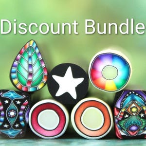 May include: A collection of seven polymer clay canes featuring diverse patterns including a leaf shape, a black circle with a white star, a rainbow ring, and geometric designs in vibrant colors. The text Discount Bundle is displayed above.