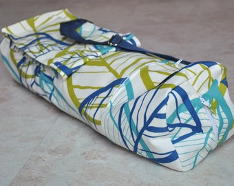 Yoga and pilates mat bag, white, blue, teal, and green leaf patterned boho chic yoga bag with zipper, pockets, and adjustable strap