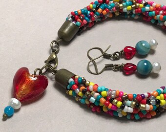 Multicolor braided seed bead bracelet with glass heart charm + coordinating earring set