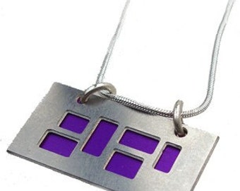 silver pendant with Purple and jet cutouts