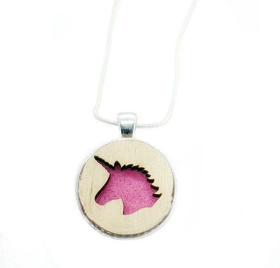 Unicorn pendant of plywood and felt