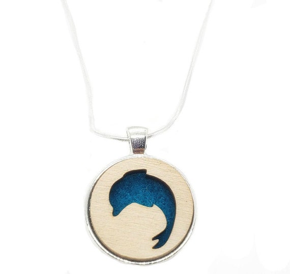 Dolphin pendant of plywood and felt