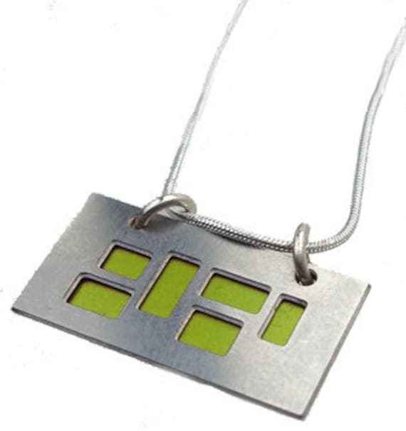 silver pendant with Lime and Black cutouts