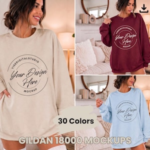 Puede incluir: Una colección de tres sudaderas de cuello redondo Gildan 18000 en beige, granate y azul claro. Cada sudadera presenta un gráfico circular en el pecho con el texto YISEDIGITALSTUDIO, Your Design Here y MOCKUP. El texto 30 Colors es visible.