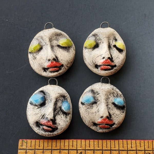 Set of Ceramic Face Charms with a steel loop