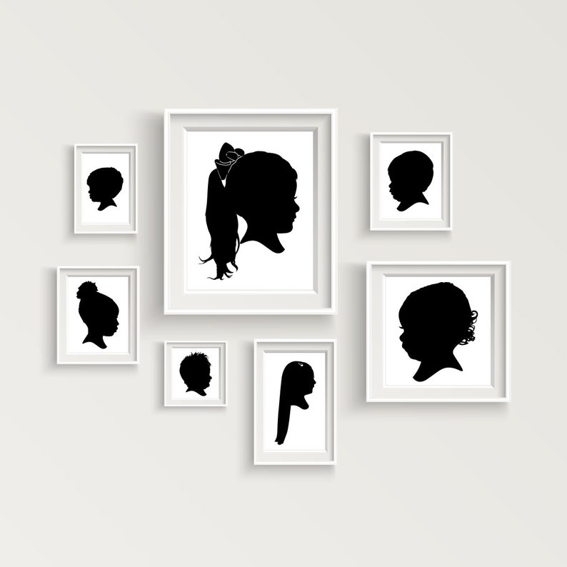 May include: A white wall with seven black and white silhouette portraits in white frames. The portraits are of children and are arranged in a grid pattern.