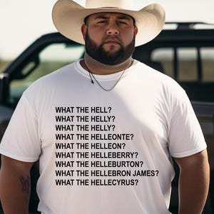 May include: A white t-shirt with the text "WHAT THE HELL?" and other similar phrases in black. The person in the image is wearing a cowboy hat and a silver chain necklace.