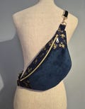 navy blue corduroy belt bag with gold floral pattern