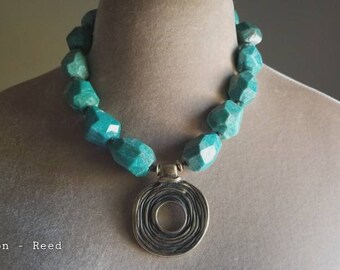 Contemporary, lush blue green large nugget beads, eternal circle pendant