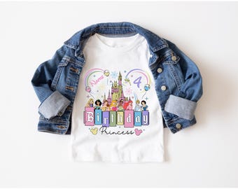 May include: White t-shirt with a colorful graphic featuring Disney princesses, a castle, and the text "Birthday Princess 4". The shirt is surrounded by a denim jacket.