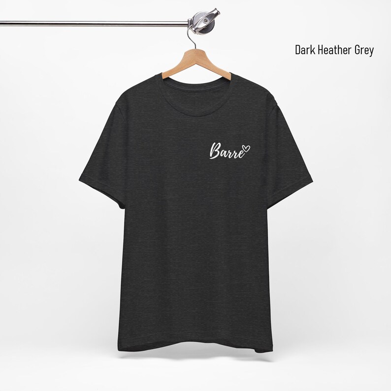 May include: Dark heather grey t-shirt with the word "Barre" and a heart on the front.