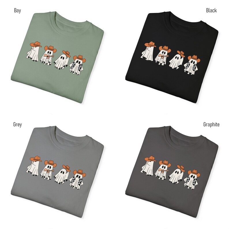 May include: Four white ghosts wearing cowboy hats and playing musical instruments. The ghosts are printed on a t-shirt in various colors: bay, black, grey, and graphite.