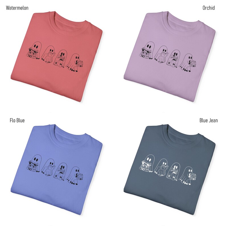 May include: Four folded t-shirts in different colors: watermelon, orchid, flo blue, and blue jean. Each shirt features a graphic of three ghosts reading books.
