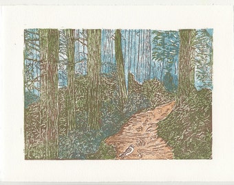 Drop Some Breadcrumbs an original multicolor woodcut print featuring a path through trees and a bird