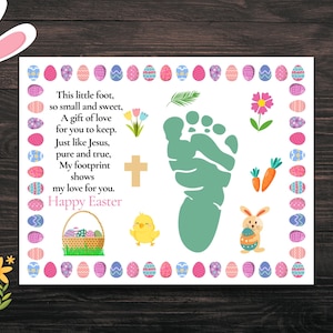 May include: Easter-themed print featuring a baby footprint in green, surrounded by colorful Easter eggs. The print includes a cross, a basket of eggs, a chick, a bunny, and the text "Happy Easter."