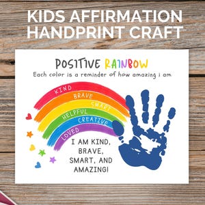 May include: A white paper sheet featuring a colorful rainbow illustration with the text "POSITIVE RAINBOW" and "Each color is a reminder of how amazing i am". It includes the words "KIND", "BRAVE", "SMART", "HELPFUL", "CREATIVE", "LOVED", and a blue handprint.