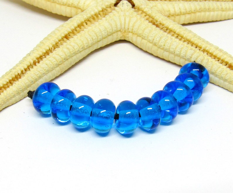 10 glassbeads, 8mm x 5mm, colorchoice hole 2mm, lampwork Aqua (Hellblau)