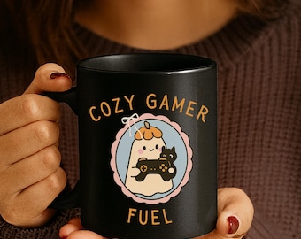 Cozy Gamer Fuel Mug: Black Ceramic Coffee Cup with Cat & Controller