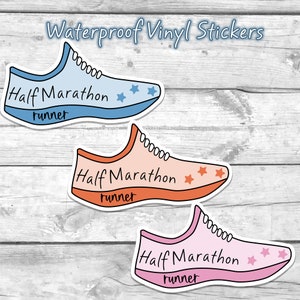 May include: Three waterproof vinyl stickers in the shape of running shoes. Each shoe is a different color: light blue, peach, and pink. The text "Half Marathon runner" is written on each shoe. Each shoe has star accents.