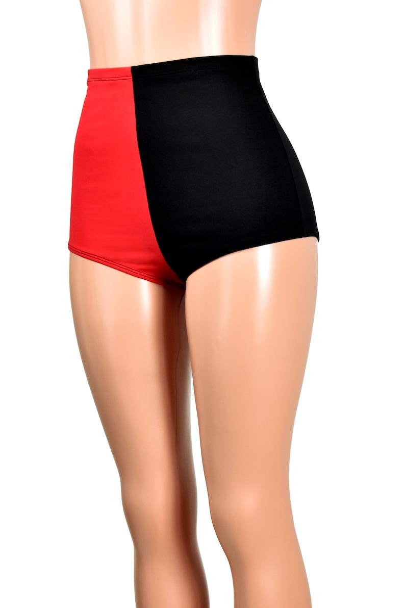 May include: High-waisted shorts featuring a color-blocked design with a solid red panel on the left side and a solid black panel on the right side. The garment has a smooth, fitted silhouette that extends from the waist to the upper thighs.