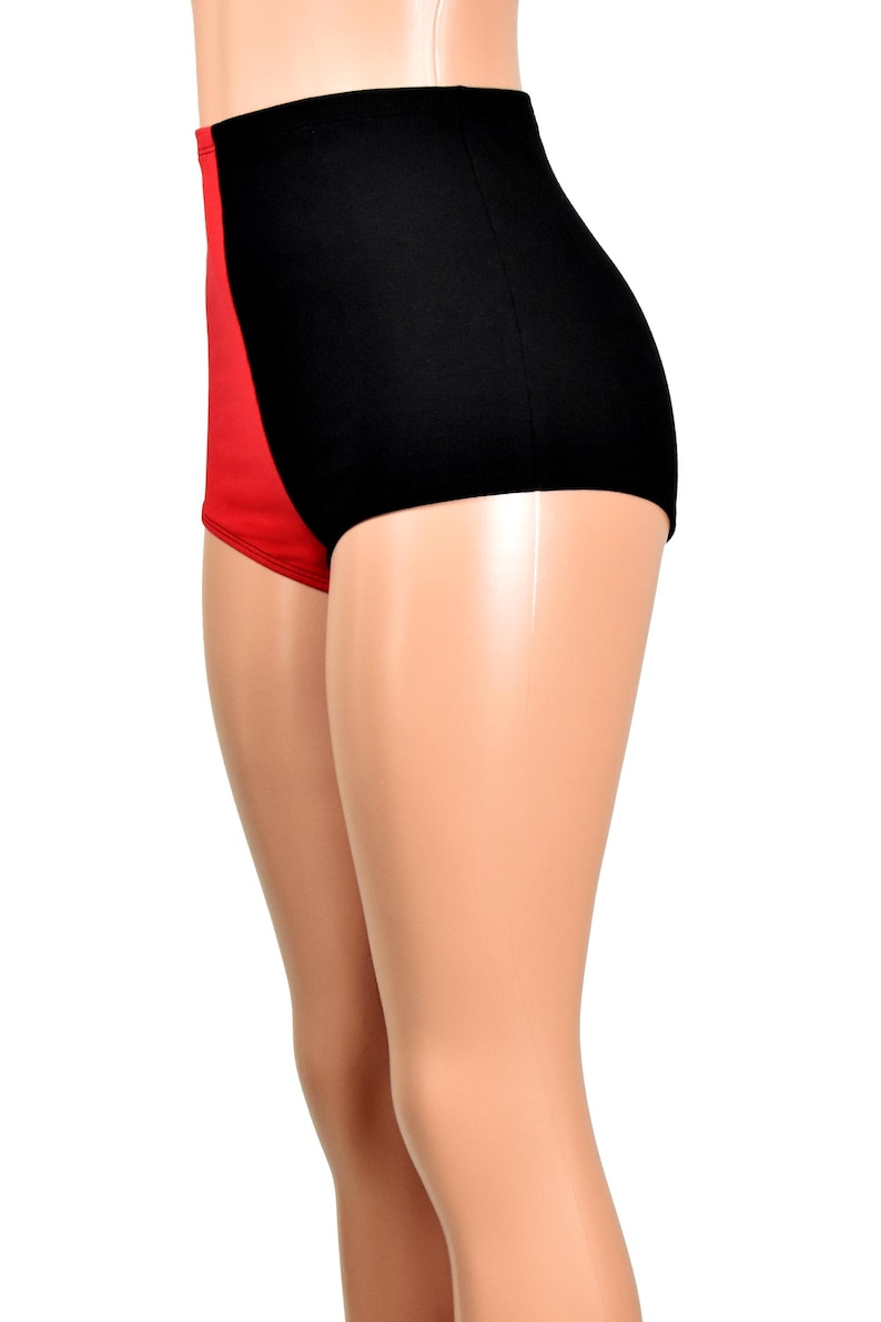 May include: High-waisted underwear featuring a color-blocked design with a solid black panel on the side and a solid red panel on the front. The garment has a smooth, fitted silhouette that extends from the waist down to the upper thigh area.