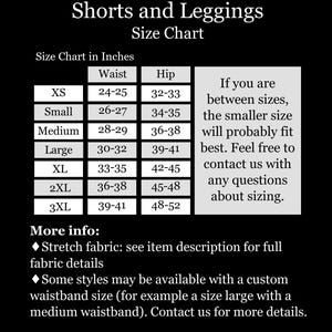 May include: A black and white size chart for shorts and leggings with text reading Shorts and Leggings Size Chart. It lists sizes XS through 3XL with corresponding waist and hip measurements in inches, plus advice for those between sizes and fabric info.