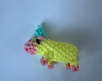 Rainbow loomed capybara with fruit on head plushie