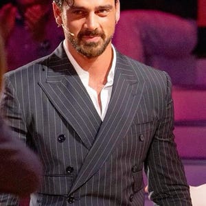 Elegant men’s custom pinstripe double breasted suit with peak lapels, tailored fit blazer, and matching trousers, designed for weddings, business, and red carpet events.