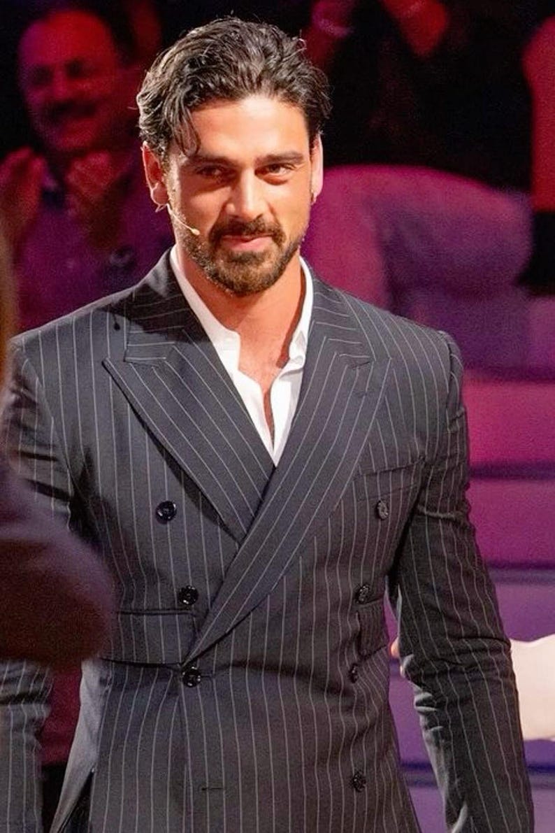 Elegant men’s custom pinstripe double breasted suit with peak lapels, tailored fit blazer, and matching trousers, designed for weddings, business, and red carpet events.