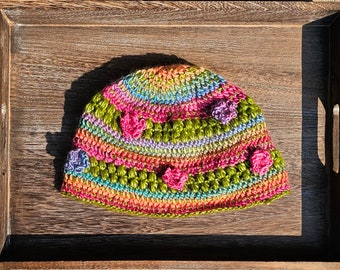 Rainbow variegated flower hat, mixed colors crochet hat, spring green, shiny yarn, rainbow beanie, hand crocheted cap, crochet art headwear