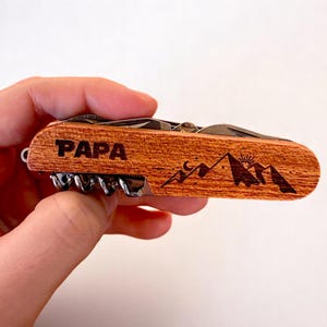 Personalized multi-tool knife, engraved wooden handle, perfect as a birthday gift, Father's Day present, or travel companion.