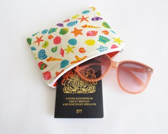 Monedero con cremallera y estampado de algodón, ideal para viajes.